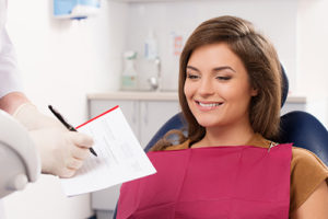 dental patient completing her intake form