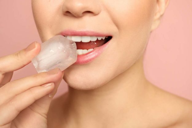 is ice bad for teeth woman about to eat some ice wondering is ice bad for teeth