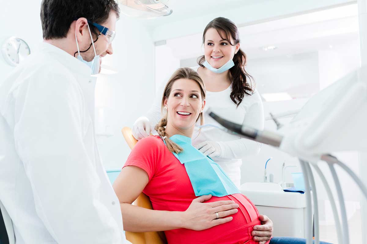 pregnant woman experiencing a dental emergency