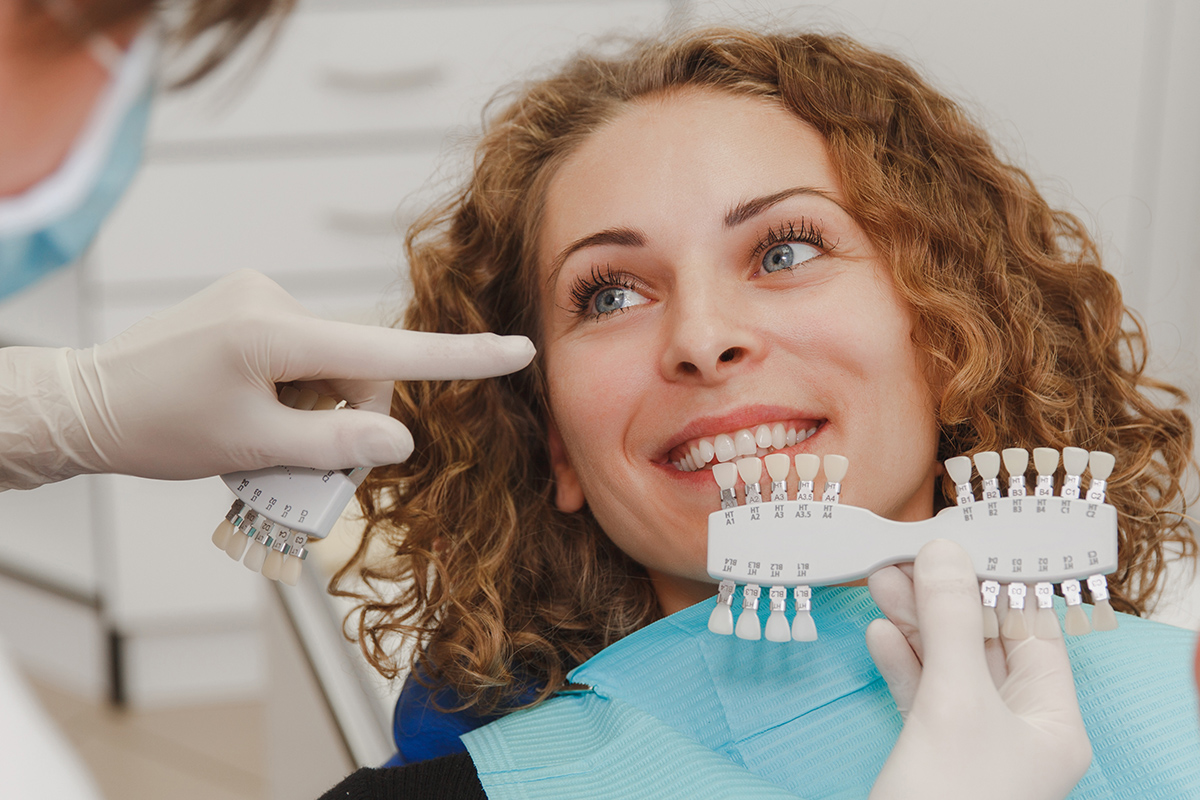 teeth whitening options (1) woman looking at different teeth whitening options