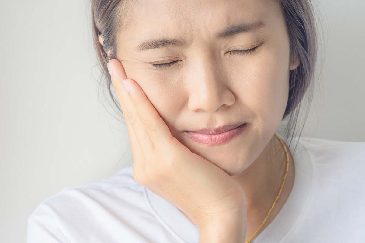 tooth-pain woman dealing with tooth pain
