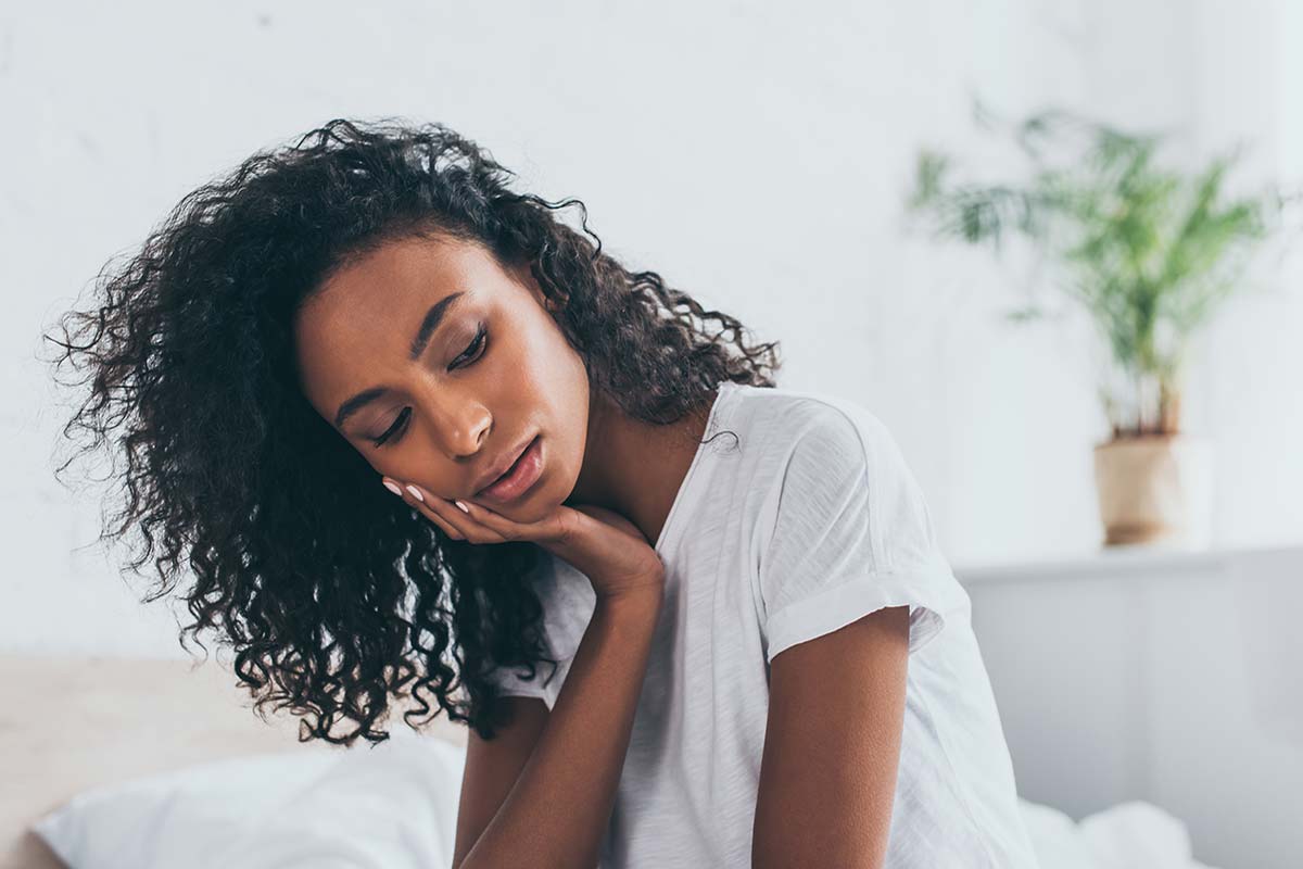 dental-appointment (1) woman holding jaw needing dental appointment