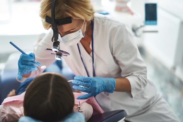 4 Common Types of Oral Surgeries (2) dentist explaining oral surgeries